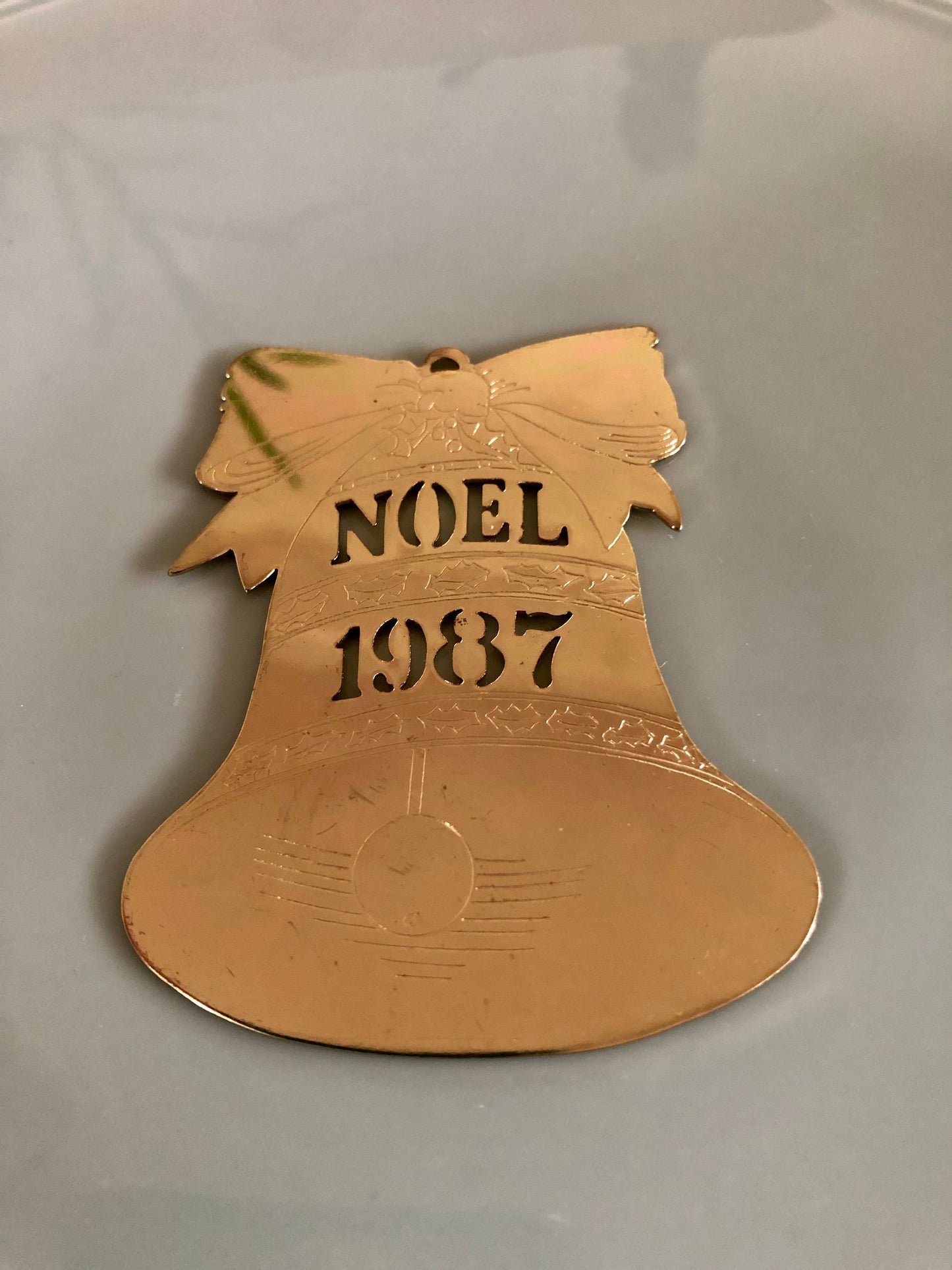 Gold, Noel 1987 Bell Cut Metal Christmas Ornament, USA Holiday Brass, Bell with Bow